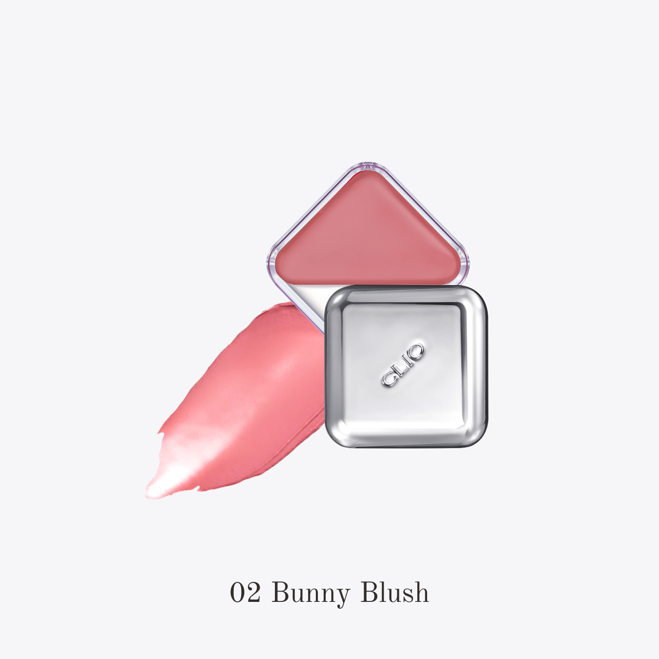 Clio Essential Lipcheek Tap blush compact open showing soft pink blush and applicator brush inside.