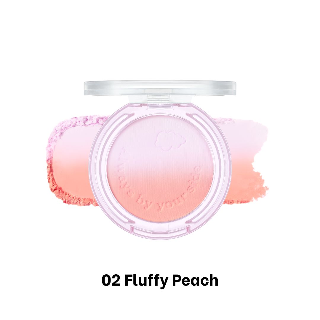 Peripera Pure Blushed Custom Cheek blush in Fluffy Peach with soft, peach-toned powder on a makeup brush.