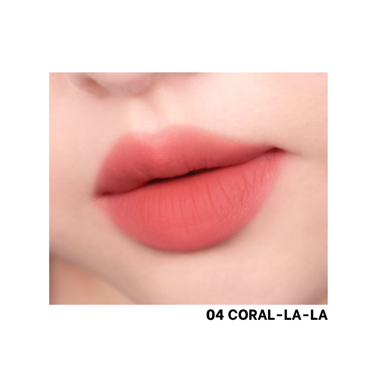 Peripera Over Blur Tint Lip Tint in Coral-La-La with a smooth, glossy finish on lips, showcasing vibrant coral color.