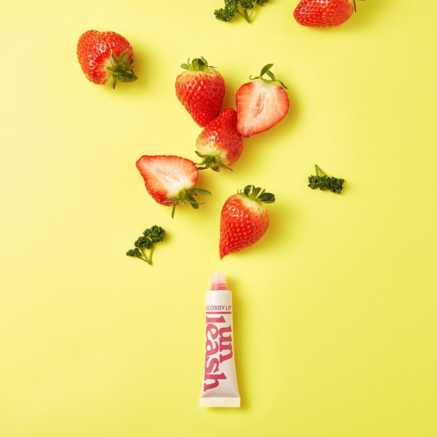 Unleashia Non Sticky Dazzle Tint lip tint in three vibrant colors, showing glossy, smooth application on lips.