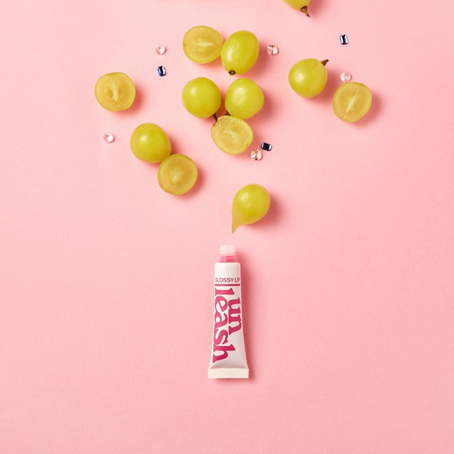 Unleashia Non Sticky Dazzle Tint lip tint in three vibrant colors, showing glossy, colorful lip application on a model.