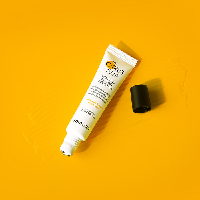 Farmstay Citrus Yuja Vitalizing Eye Serum in 25ml bottle showing the serum applicator and packaging for brightening and revitalizing the eye area.