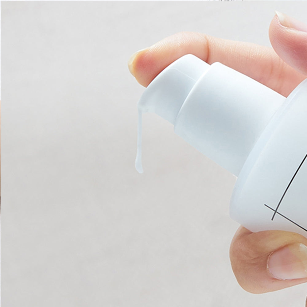 Numbuzin No.9 Secret Firming Serum 50ml bottle with dropper, showcasing clear serum in a sleek container.