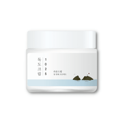 Round Lab Dokdo Cream 80ml face moisturizer jar with a white lid and minimalist label, showcasing the skincare product.