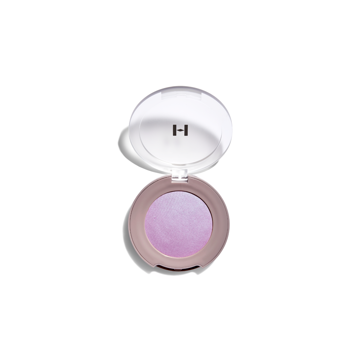 Hince True Dimension Glow Cheek blush in a soft pink shade, displayed in a sleek compact with the blush visible.