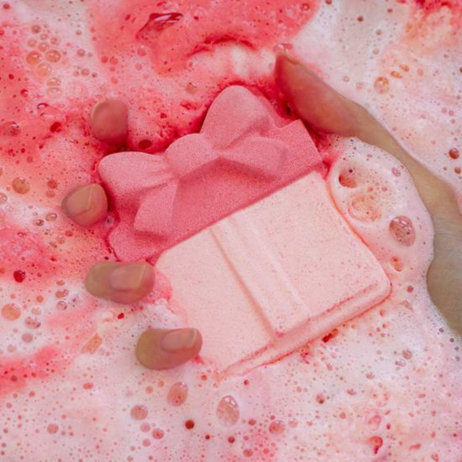 Round A’Round Raspberry Bubble Bath Bomb 110g with vibrant pink and purple colors, showcasing its playful, fruity design and packaging detail.