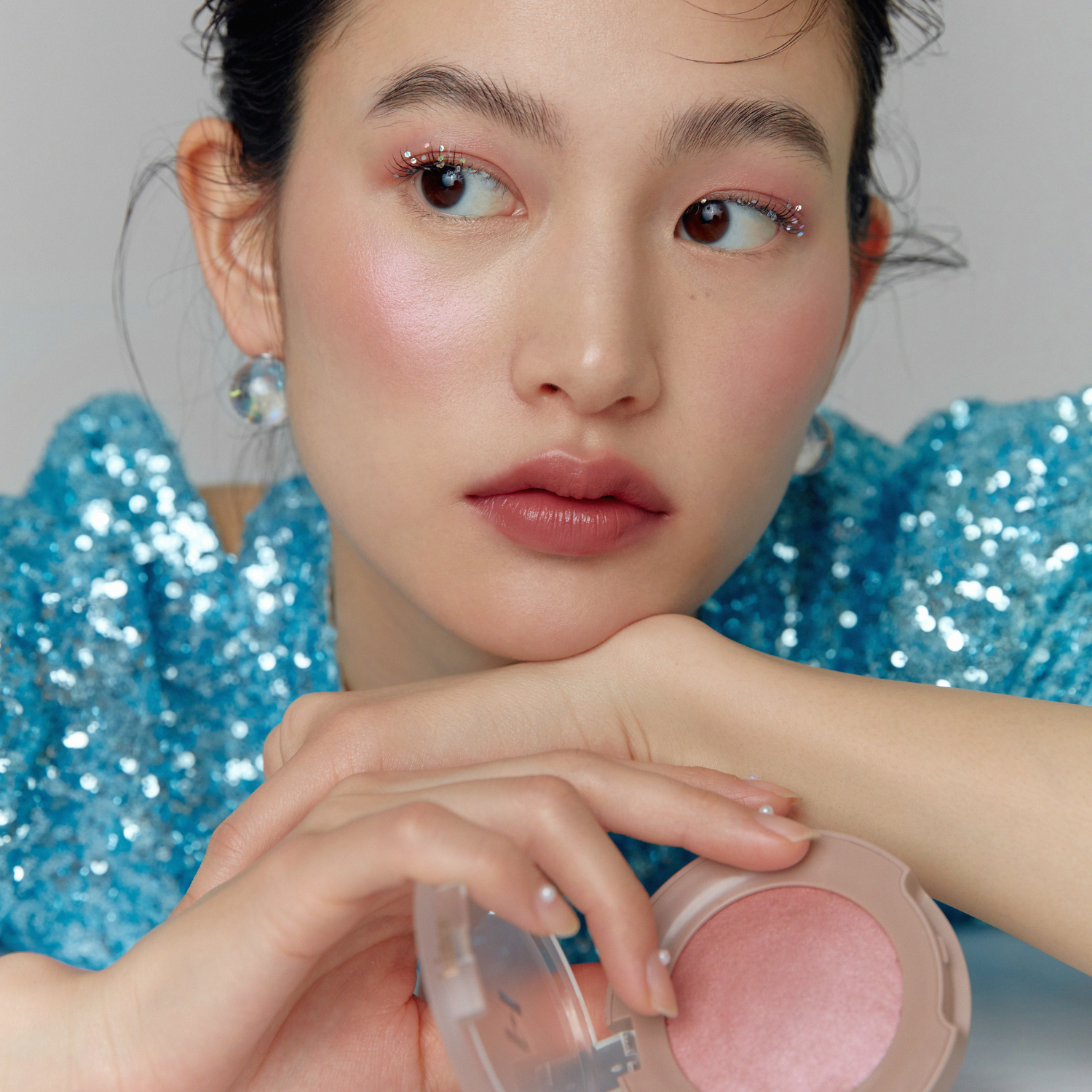 Hince True Dimension Glow Cheek blush in a soft pink shade, showcasing its smooth, blendable powder texture and natural finish.