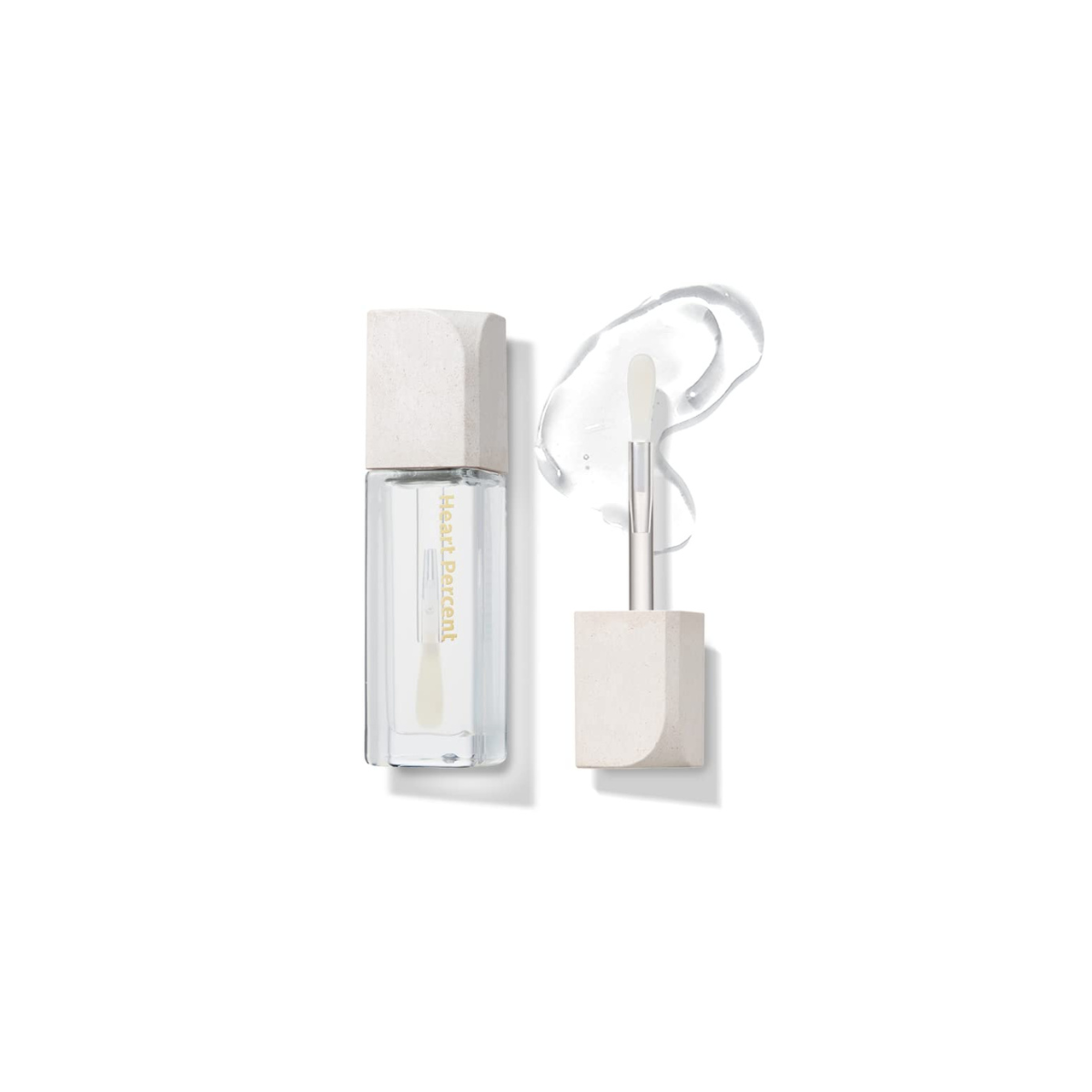 Heart Percent Commas on Life Essential Lip Essence lip gloss tube in 4.5ml with a glossy finish and minimalist design.