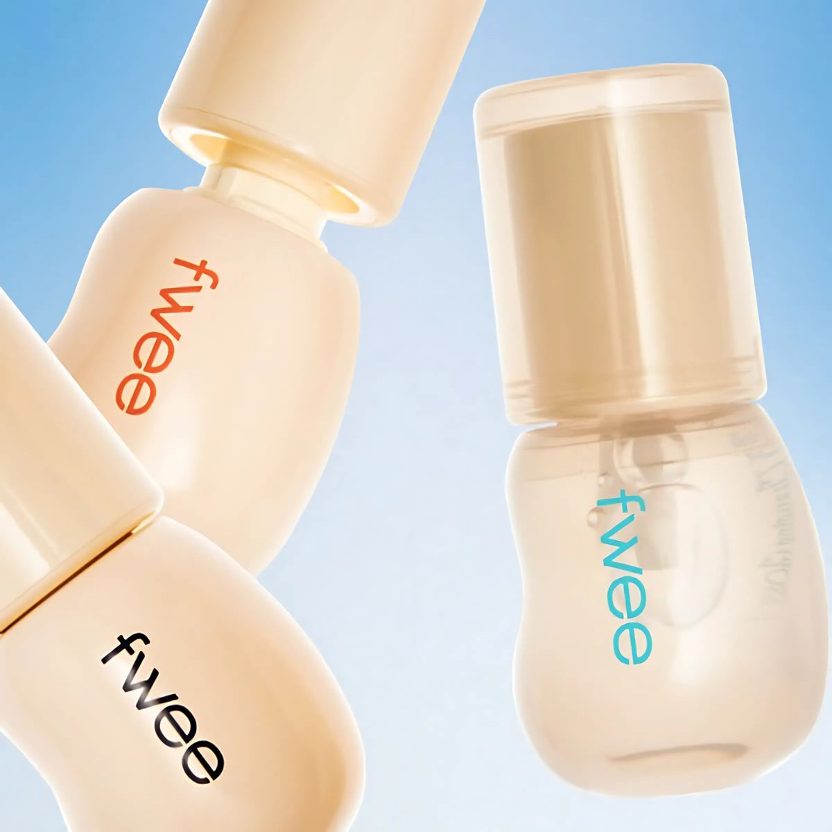 Fwee 3D Changing Gloss lip gloss in three colors, glossy finish, with a smooth applicator and vibrant packaging.