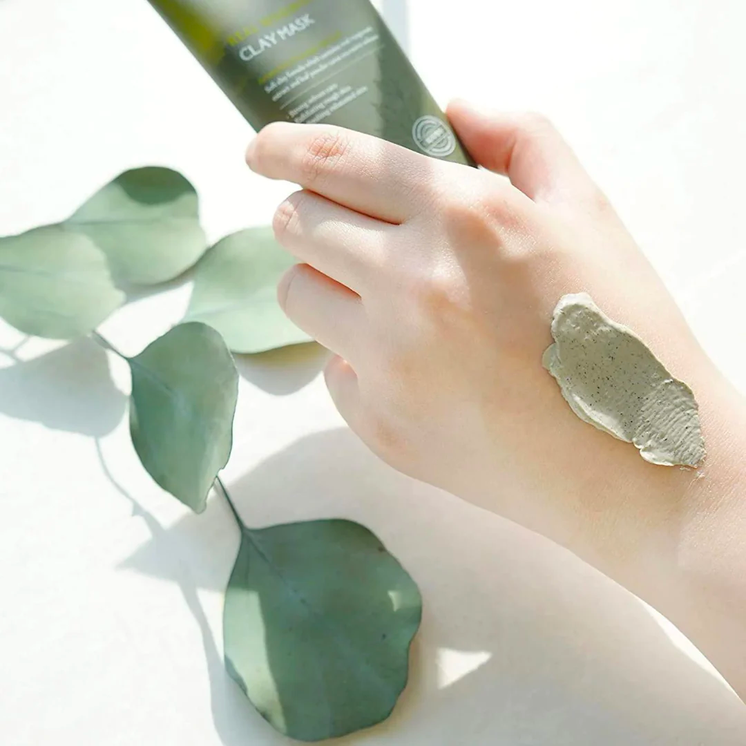 Isntree Mugwort Calming Clay Mask in a 100 mL jar, showcasing the eco-friendly packaging and fresh clay mask texture.