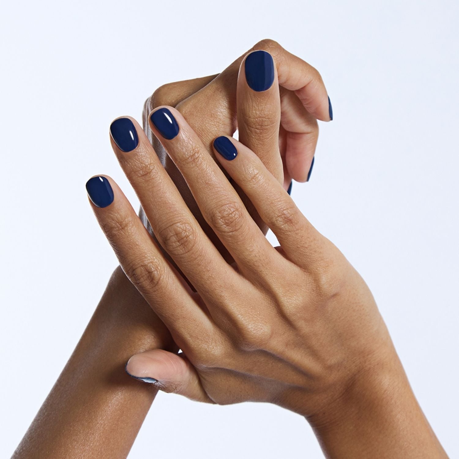 Ohora semi-cured gel nail in N Royal Navy with a sleek navy blue finish, showcasing a smooth, glossy nail design.