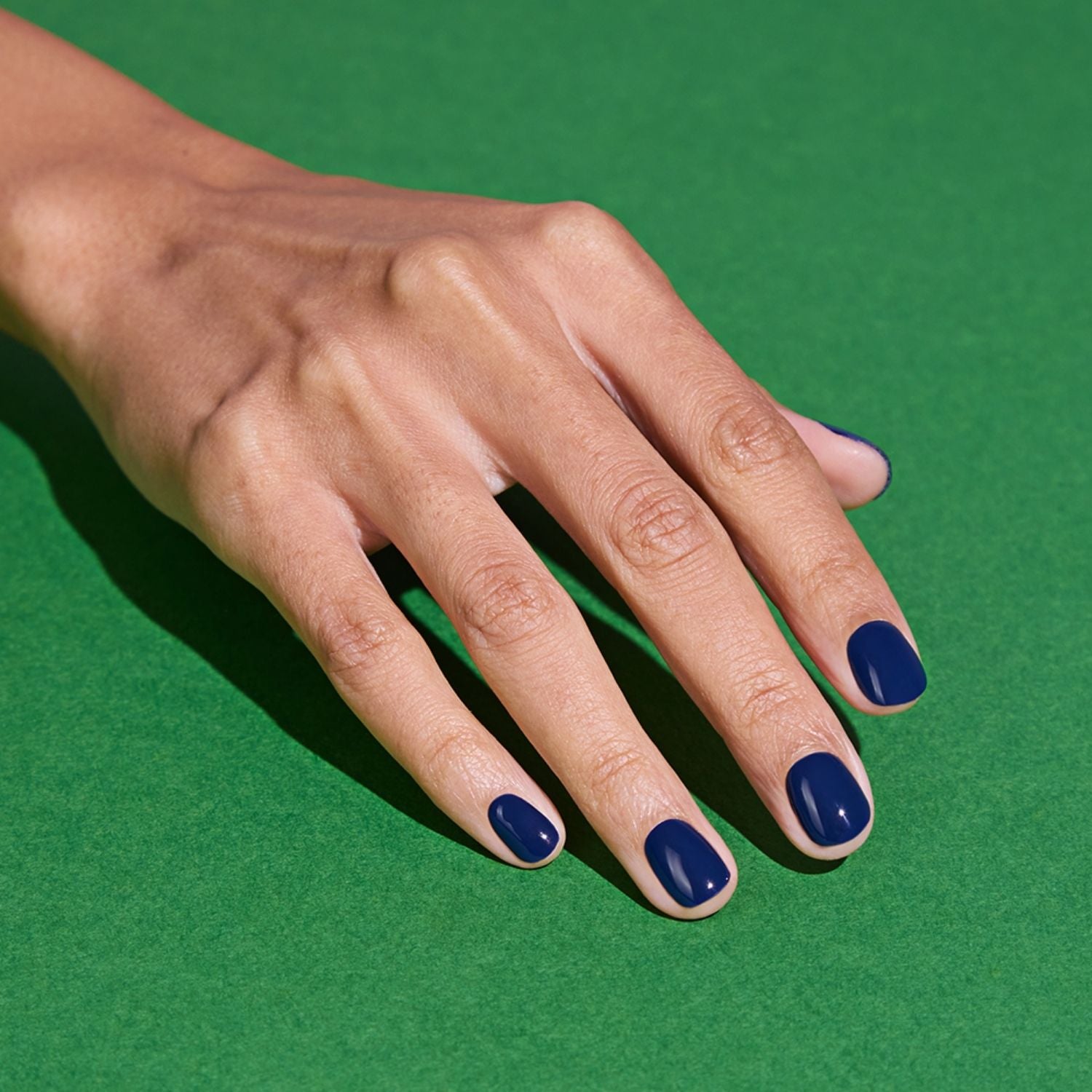Ohora N Royal Navy semi-cured gel nail set with navy blue and subtle shimmer finish, showcasing elegant nail design.