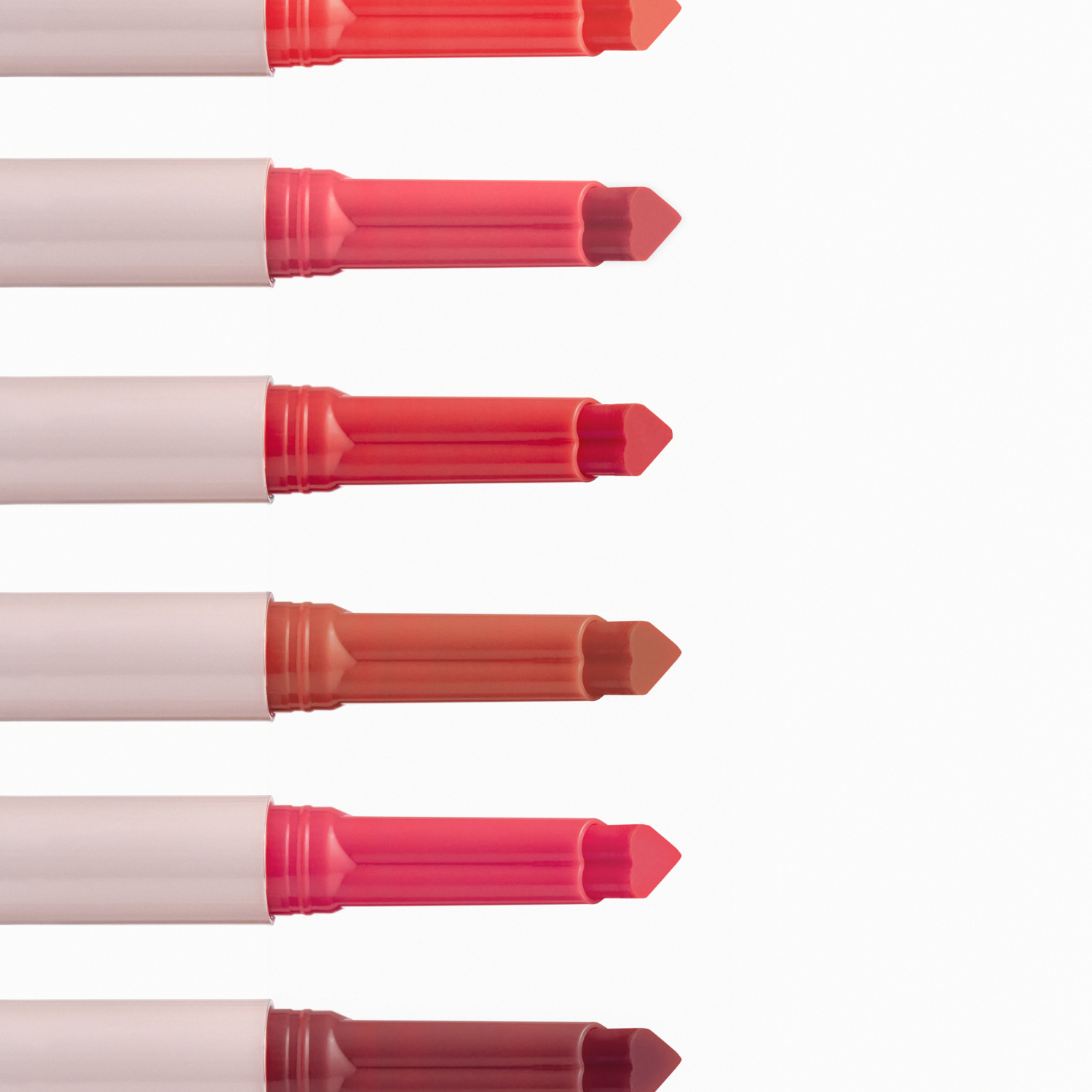 Peripera Heart Jam Glow Lipstick in a vibrant pink shade, showing the lipstick bullet with heart-shaped design on the packaging