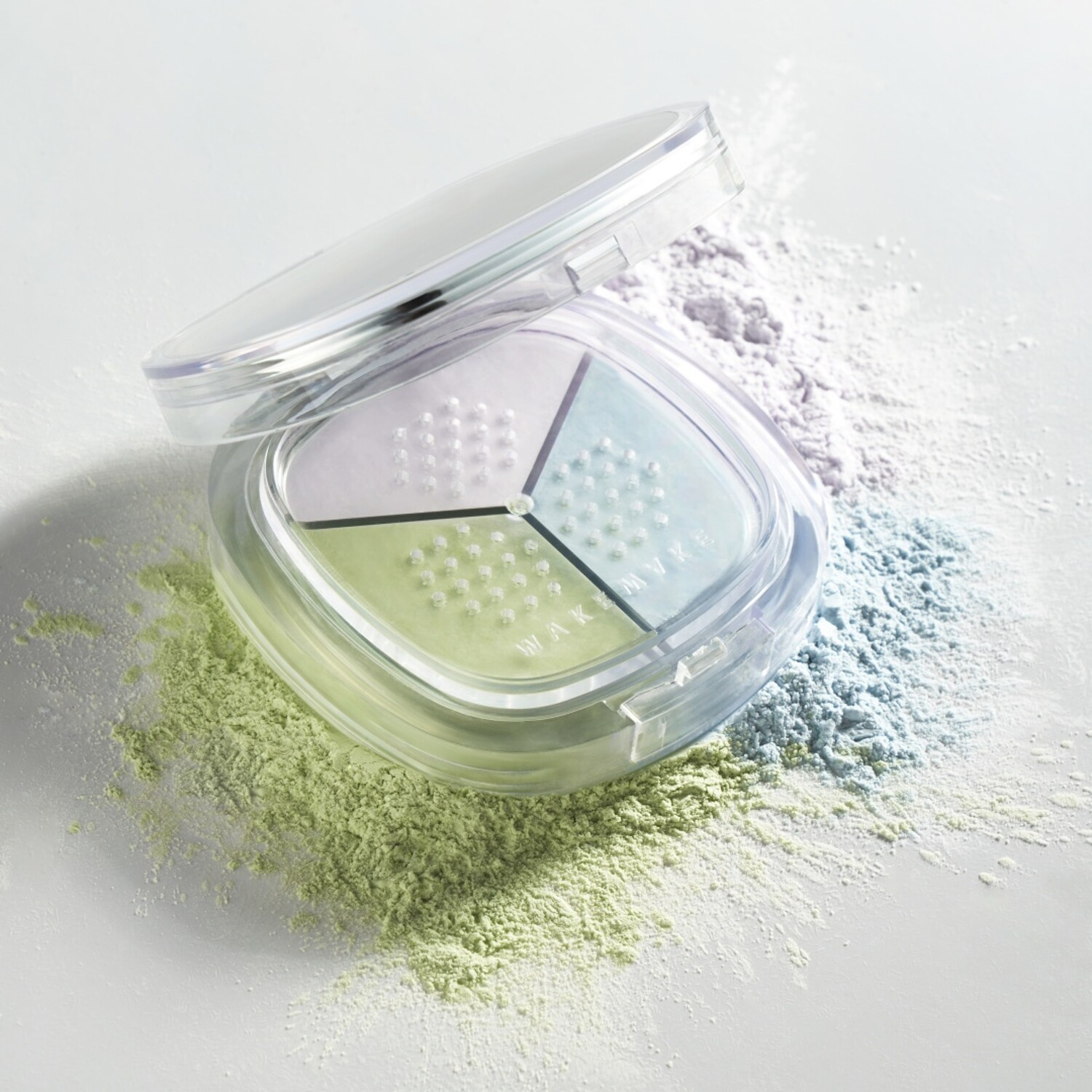 Wakemake Stay Fixer Multi Color Setting Powder in a compact with soft, blended powder shades for a natural finish.