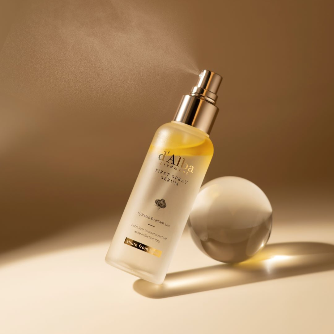 d'Alba White Truffle First Spray Serum face mist in a clear spray bottle with a white label, ready for skincare application.