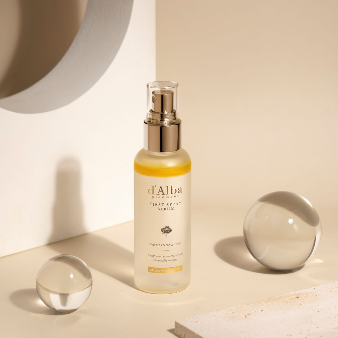 d'Alba White Truffle First Spray Serum face mist in a clear spray bottle, showcasing the luxurious packaging and mist nozzle.