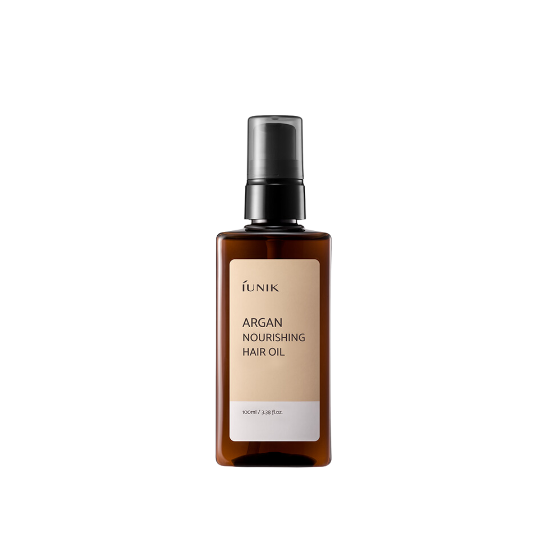 iUNIK Argan Nourishing Hair Oil 100ml bottle, conditioner and treatment, with golden oil and sleek packaging visible.