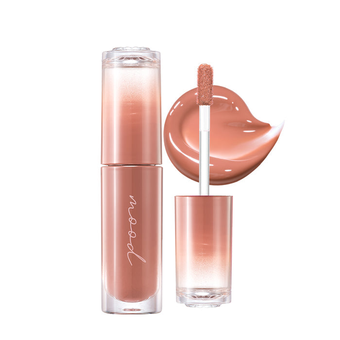 Peripera Ink Mood Glowy Tint Honey K-ookie lip tint tube with soft peach-colored tint and shiny cap, close-up shot.
