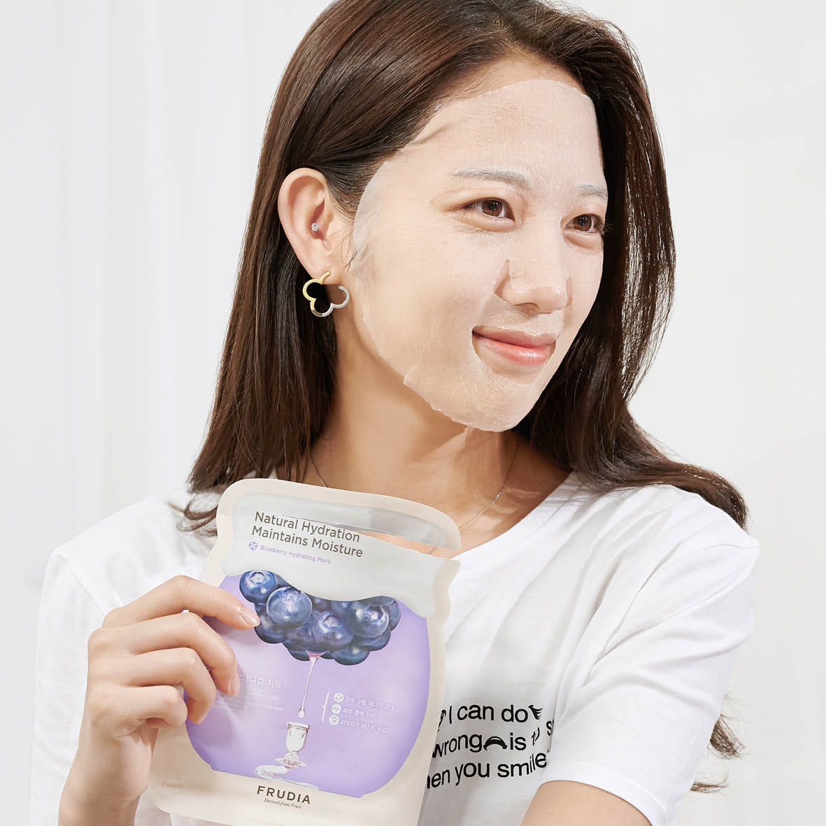 Frudia Blueberry Hydrating Sheet Mask with blueberry extract, shown on a white background, ready for glowing skin hydration.