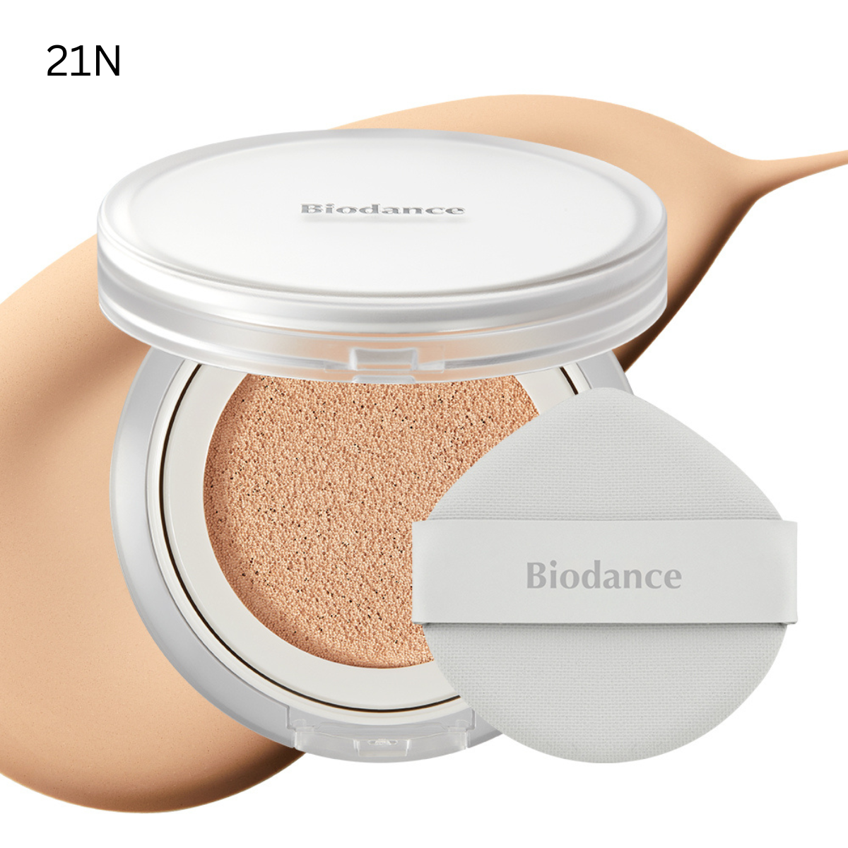 Biodance Radiant Pure Essence Cushion foundation in a compact case with a mirror and applicator sponge visible.
