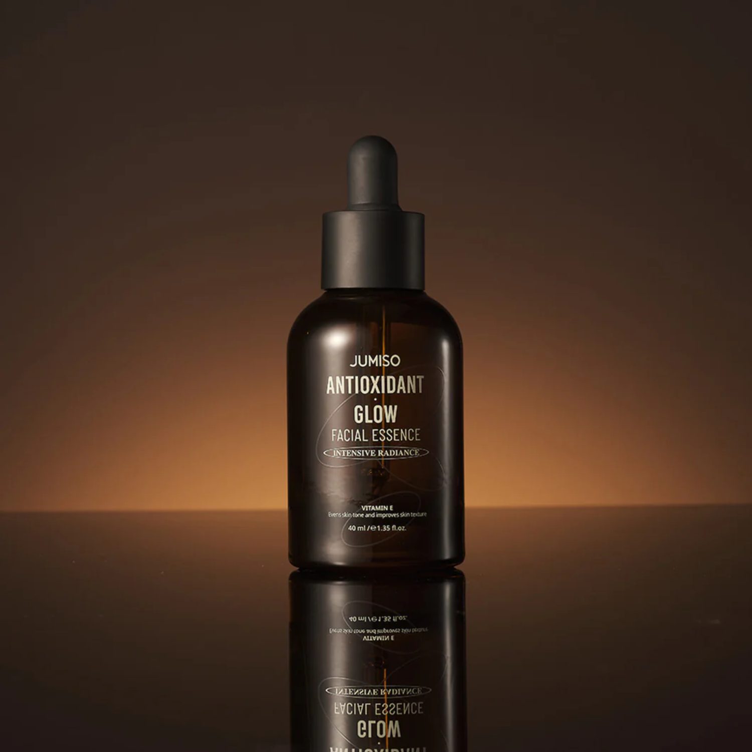 Jumiso Antioxidant Glow Facial Essence bottle with clear label and dropper cap, showcasing a bright, glowing skincare product.