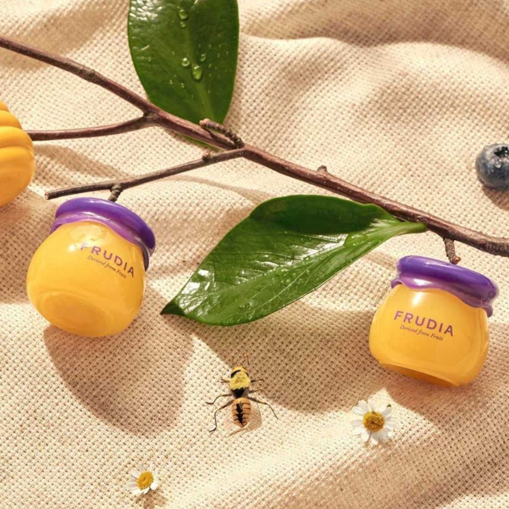 Frudia Blueberry Hydrating Honey Lip Balm in 10ml tube, moisturizing and nourishing lip balm with blueberry extract.