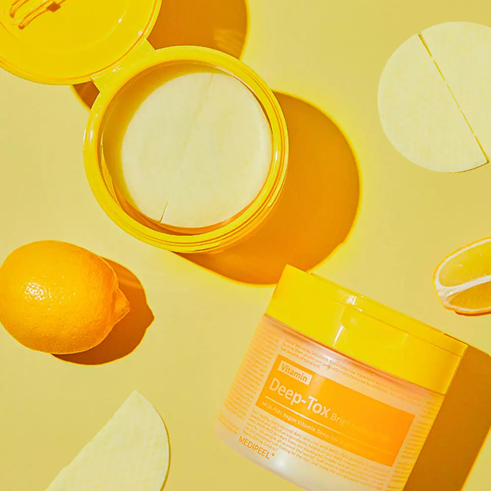 Vegan Vitamin Deep-Tox Brightening Toner Pad by MEDIPEEL+ shown in a box of 70 pads with textured surface for skincare.