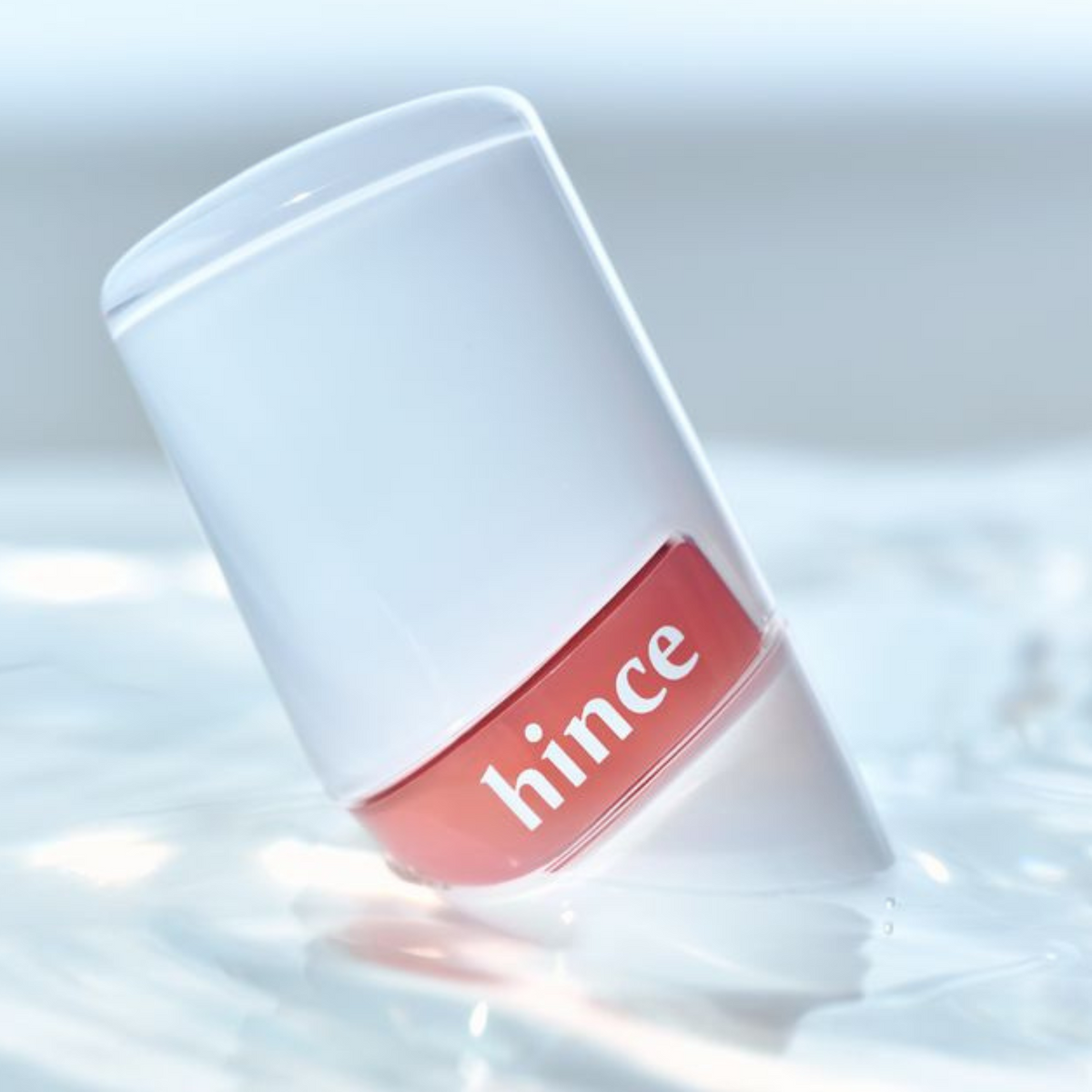 Hince Raw Glow Gel Tint in Chill Voyage Edition, lip tint with a smooth gel texture, shown on lips with a natural, glossy finish.