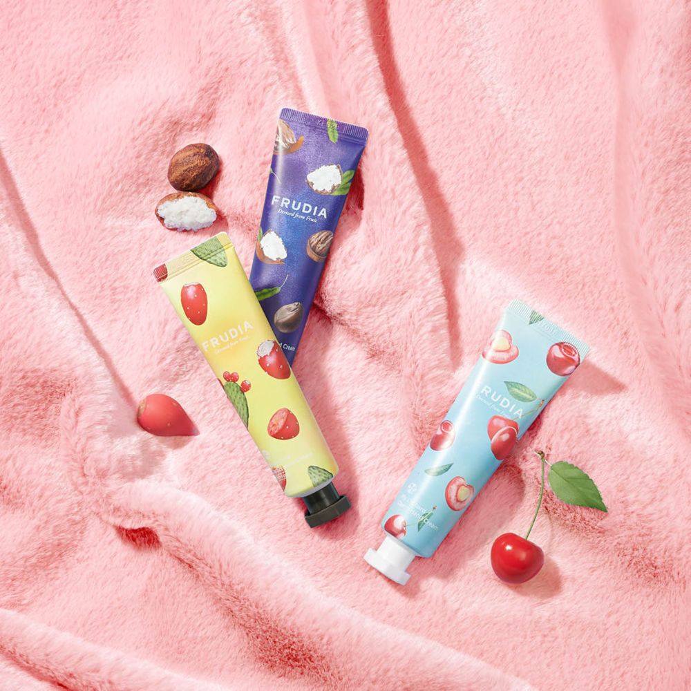 Frudia My Orchard Hand Cream tube with floral design, showcasing moisturizing hand cream for soft, nourished skin.