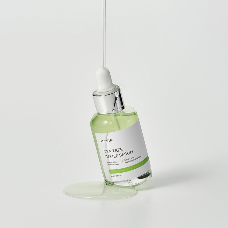 iUNIK Tea Tree Relief Serum 50ml bottle with dropper, featuring clear packaging and a white label for soothing skin treatment