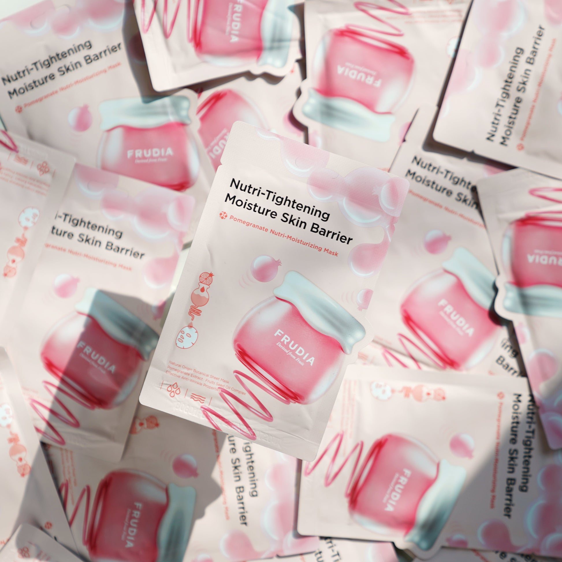 Frudia Pomegranate Nutri-Moisturizing Sheet Mask showing a vibrant red mask with pomegranate imagery on the packaging