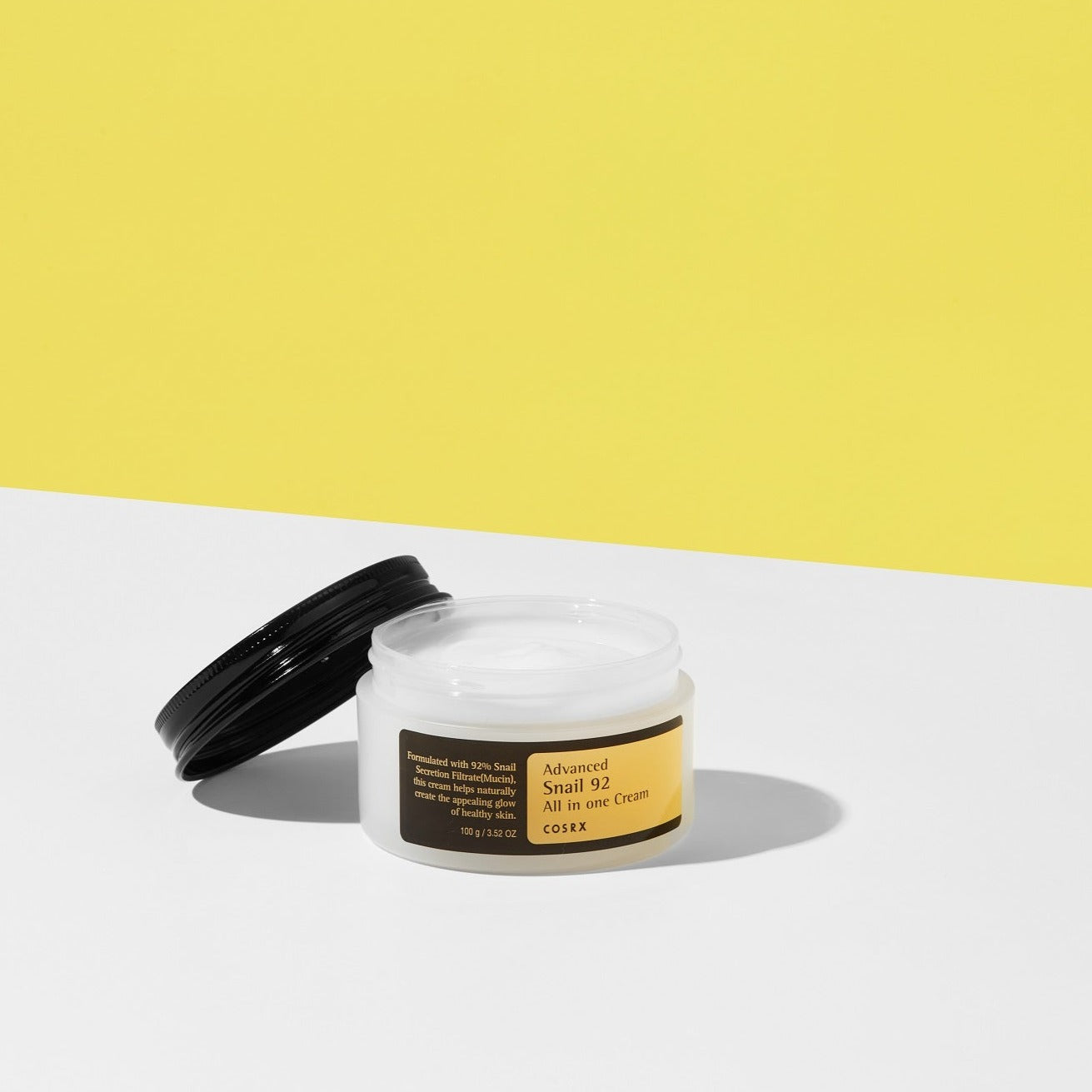 COSRX Advanced Snail 92 All in One Cream 100g face moisturizer jar with a sleek design and clear labeling.