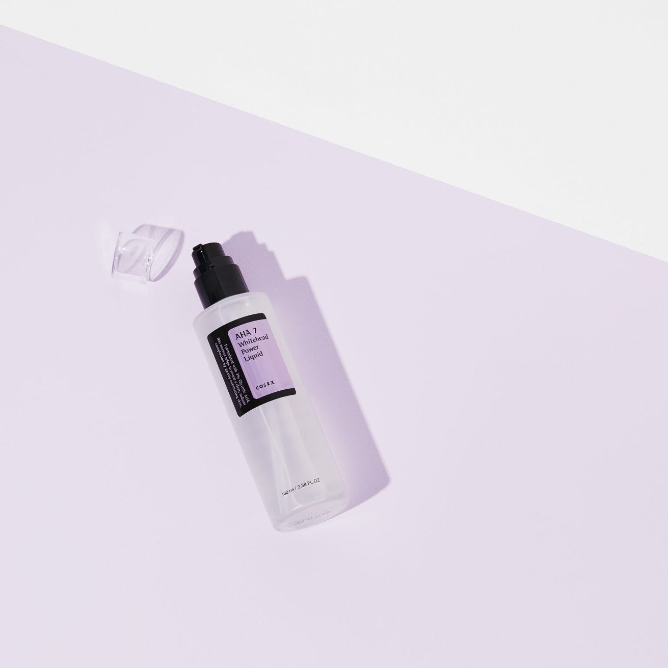 COSRX AHA 7 Whitehead Power Liquid essence bottle, showing clear liquid and minimalist packaging design.