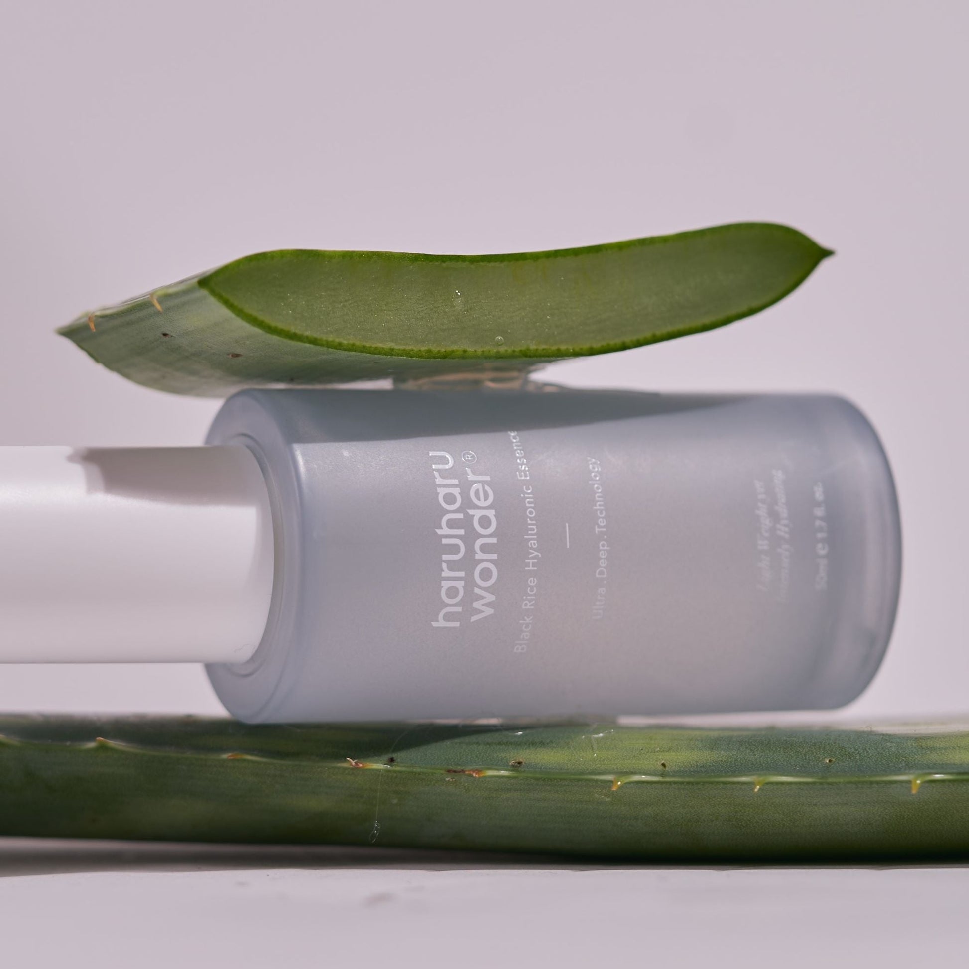 Black Rice Hyaluronic Essence from Haruharu Wonder in a 50ml bottle, showcasing the sleek black packaging and clear label.