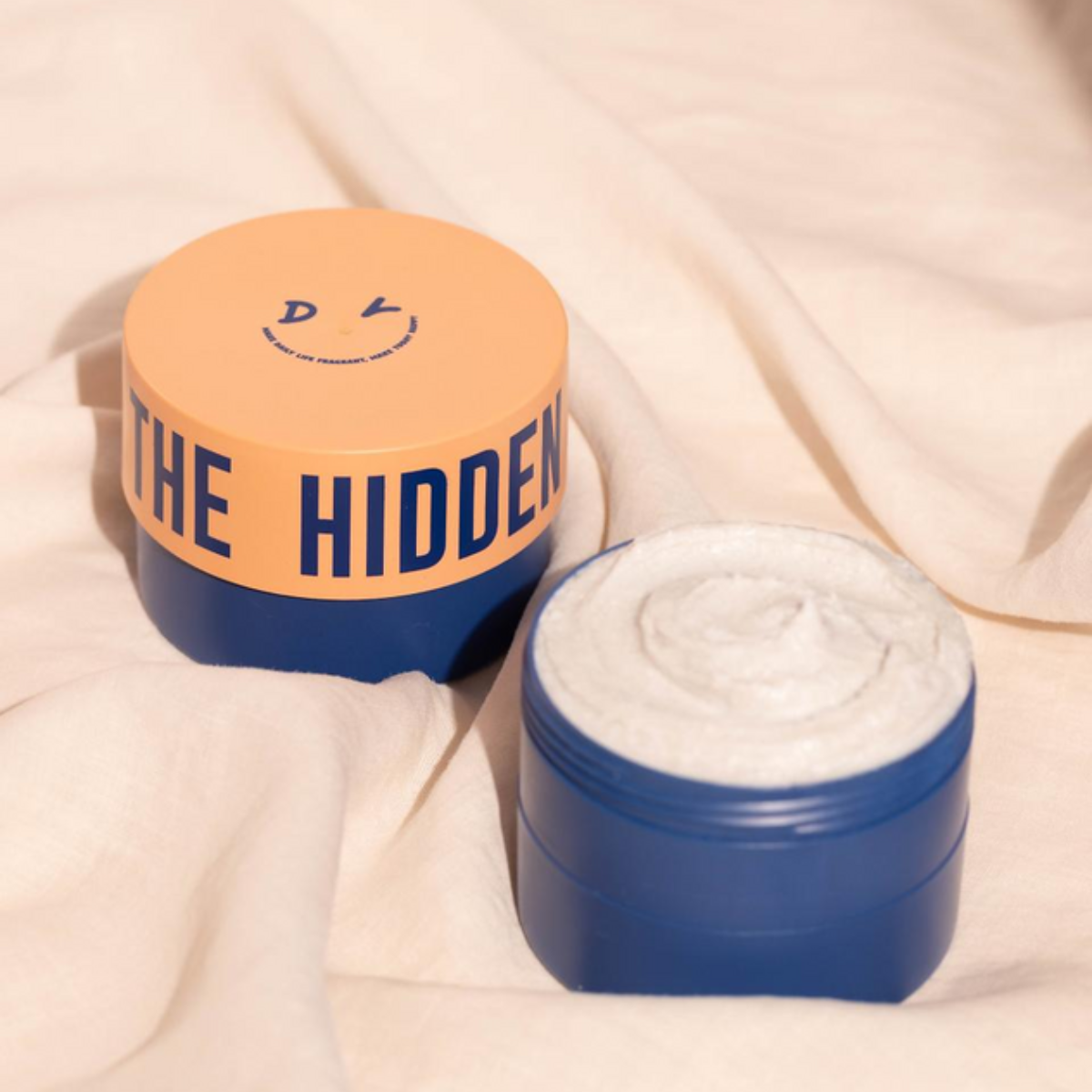 Dear Doer The Hidden Scrub body wash and scrub with natural exfoliating ingredients in a sleek bottle.