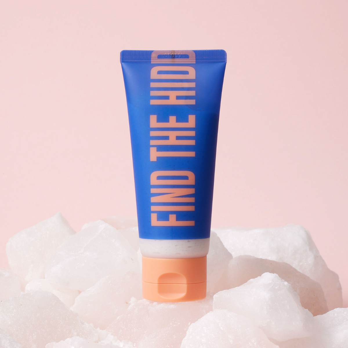 Dear Doer The Hidden Scrub body wash and scrub bottle with label and pump dispenser, creamy texture visible in the image.