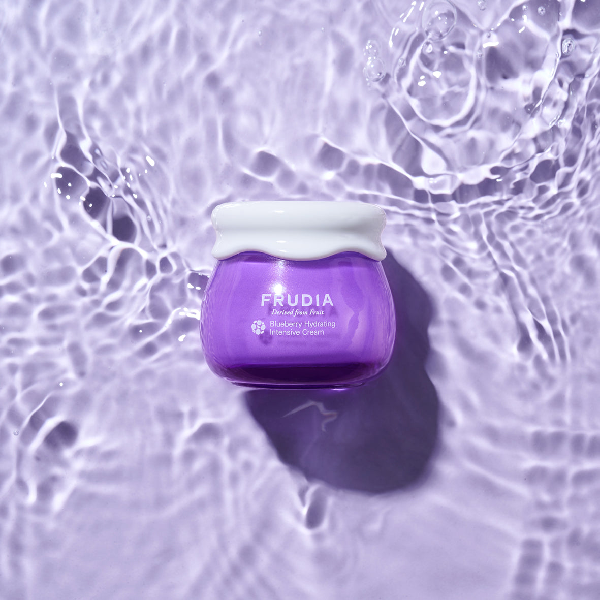 Frudia Blueberry Hydrating Intensive Cream, face moisturizer in a blue jar with a white lid, showing the product label.