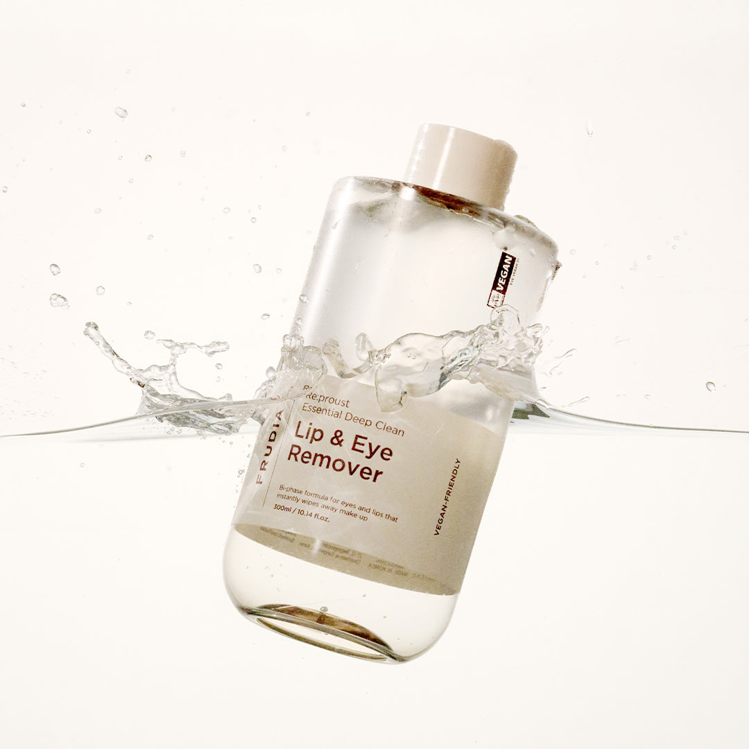 Frudia Re:proust Essential Deep Clean Lip and Eye Makeup Remover in a 300ml bottle, showing the clear liquid and packaging.