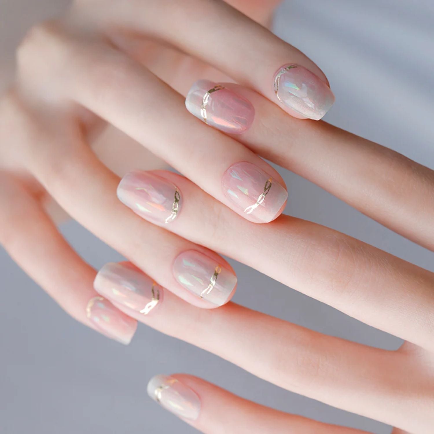 Ohora Semi-Cured Gel Nail in N Pink Mermaid with shimmering pink and iridescent accents, showcasing a stylish, mermaid-inspired nail design.