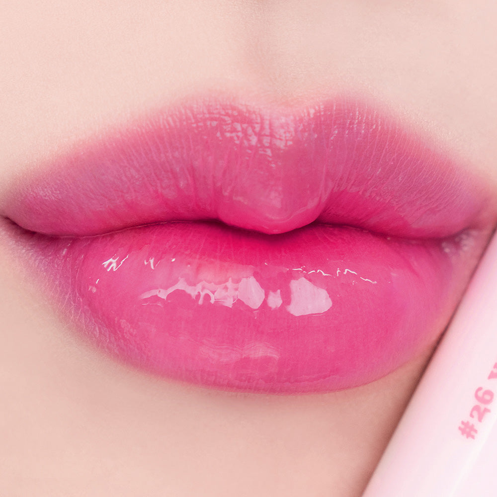 Rom&nd Juicy Lasting Lip Tint in shade 26, showing a close-up of the vibrant, glossy lip tint applied on lips.
