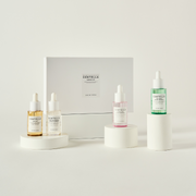 SKIN1004 Madagascar Centella Ampoule Kit with bottles and packaging, featuring natural ingredients and skincare product display.