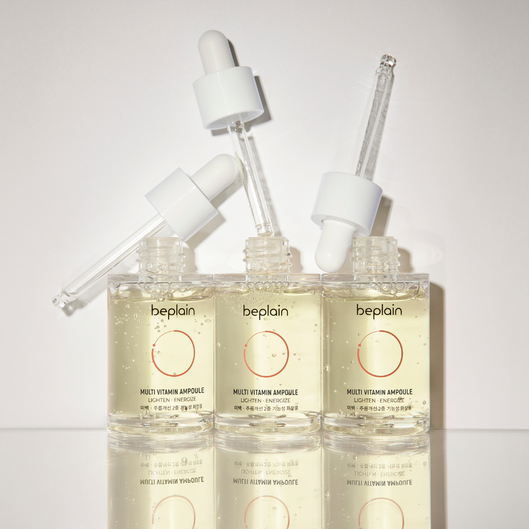 Beplain Multi Vitamin Ampoule 30ml in a clear glass bottle, featuring a dropper cap and vibrant label for skincare nourishment.