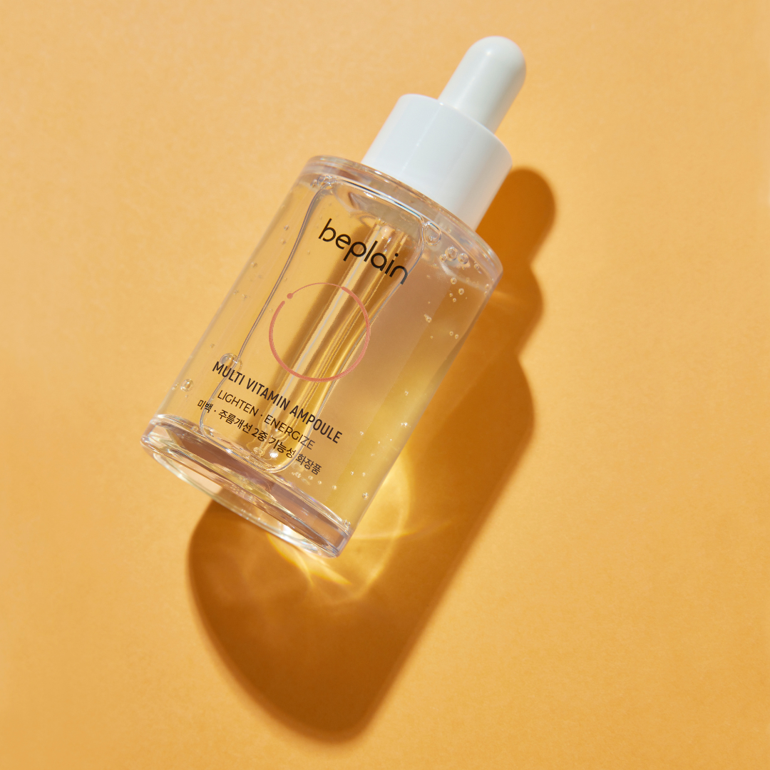 Beplain Multi Vitamin Ampoule 30ml in a clear glass bottle with dropper, showing the vibrant liquid inside.