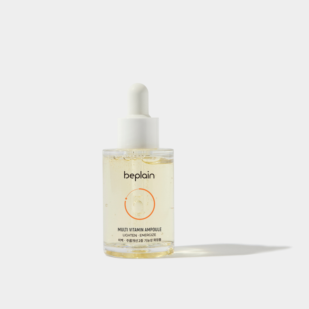 Beplain Multi Vitamin Ampoule 30ml in a clear glass bottle, with a dropper cap, showcasing vibrant liquid for skincare.