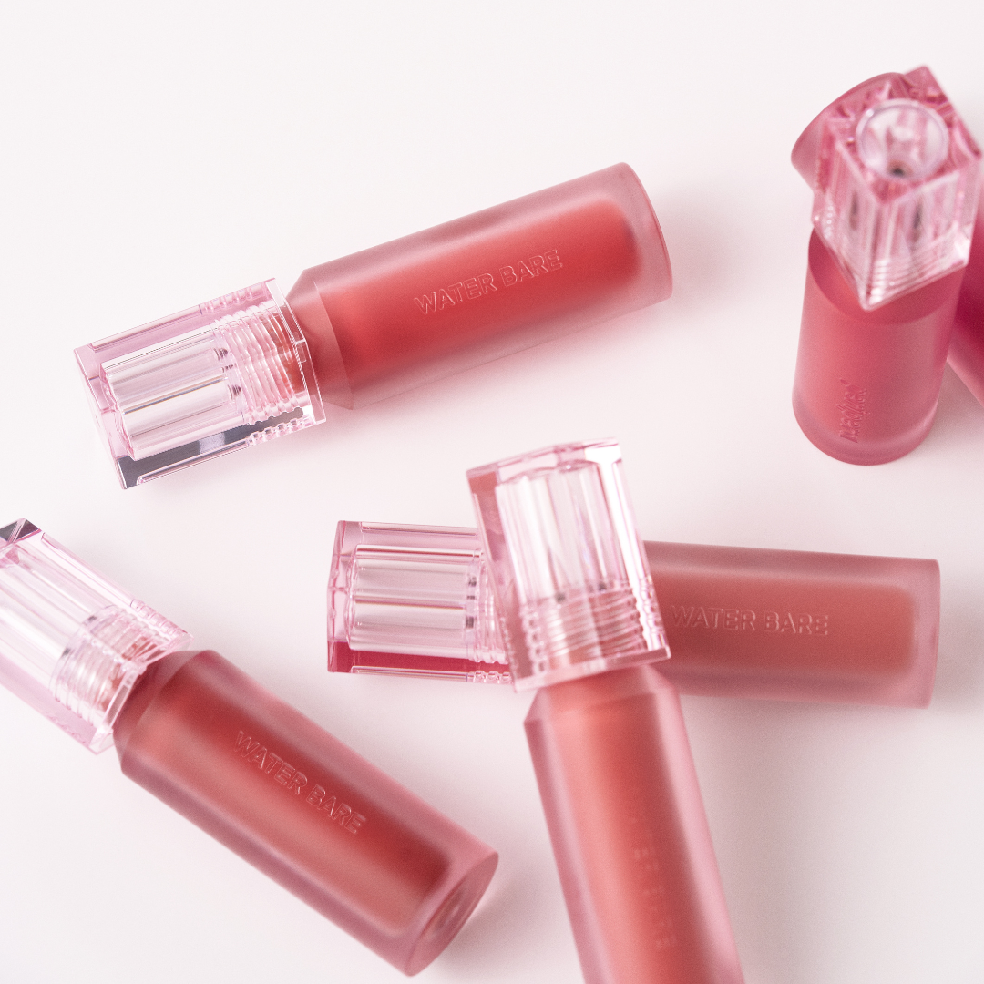 Peripera Water Bare Tint lip tint in shade 27, showing the sleek packaging and vibrant color inside the tube.