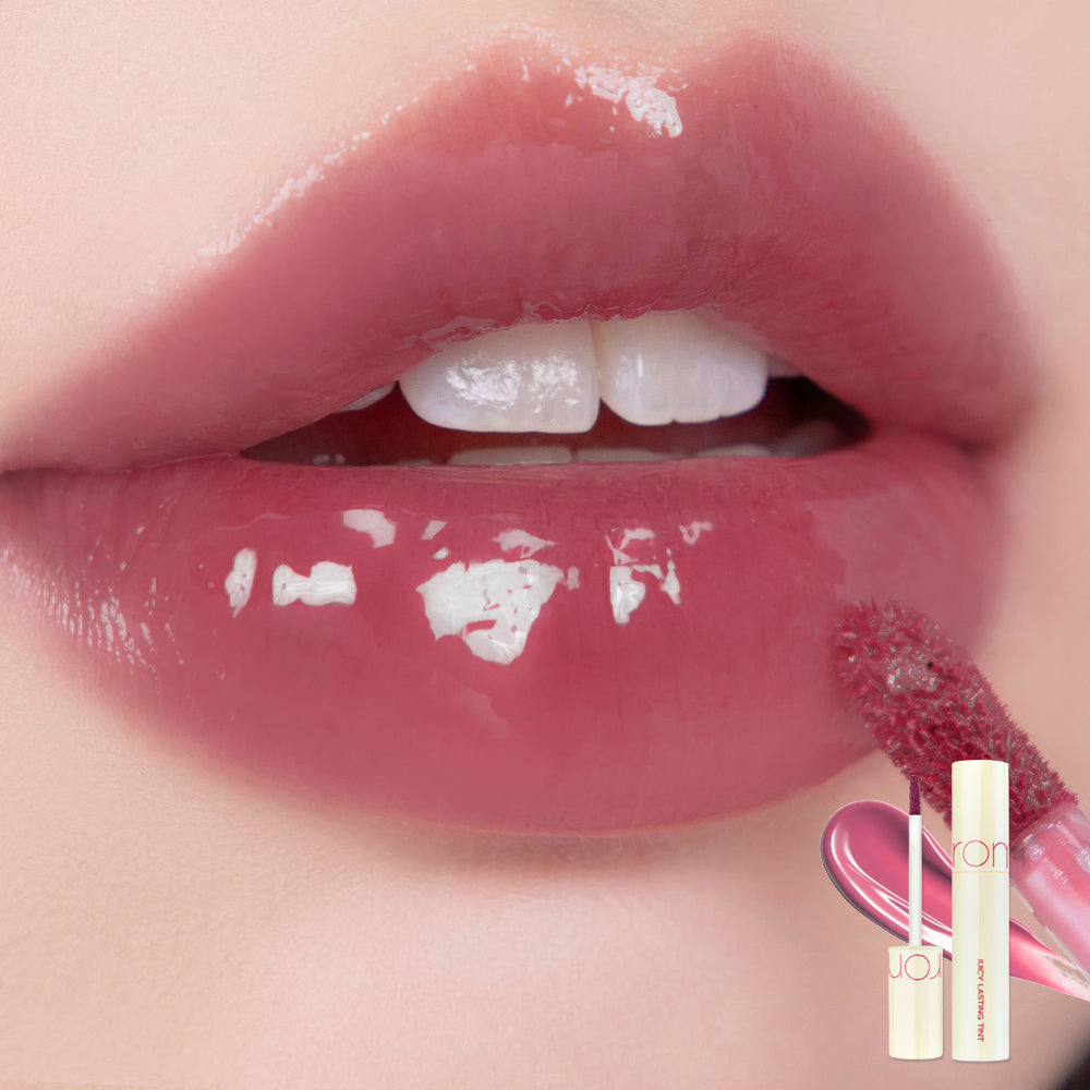 Rom&nd Juicy Lasting Tint lip tint tube with vibrant pink-colored product visible in a close-up shot.
