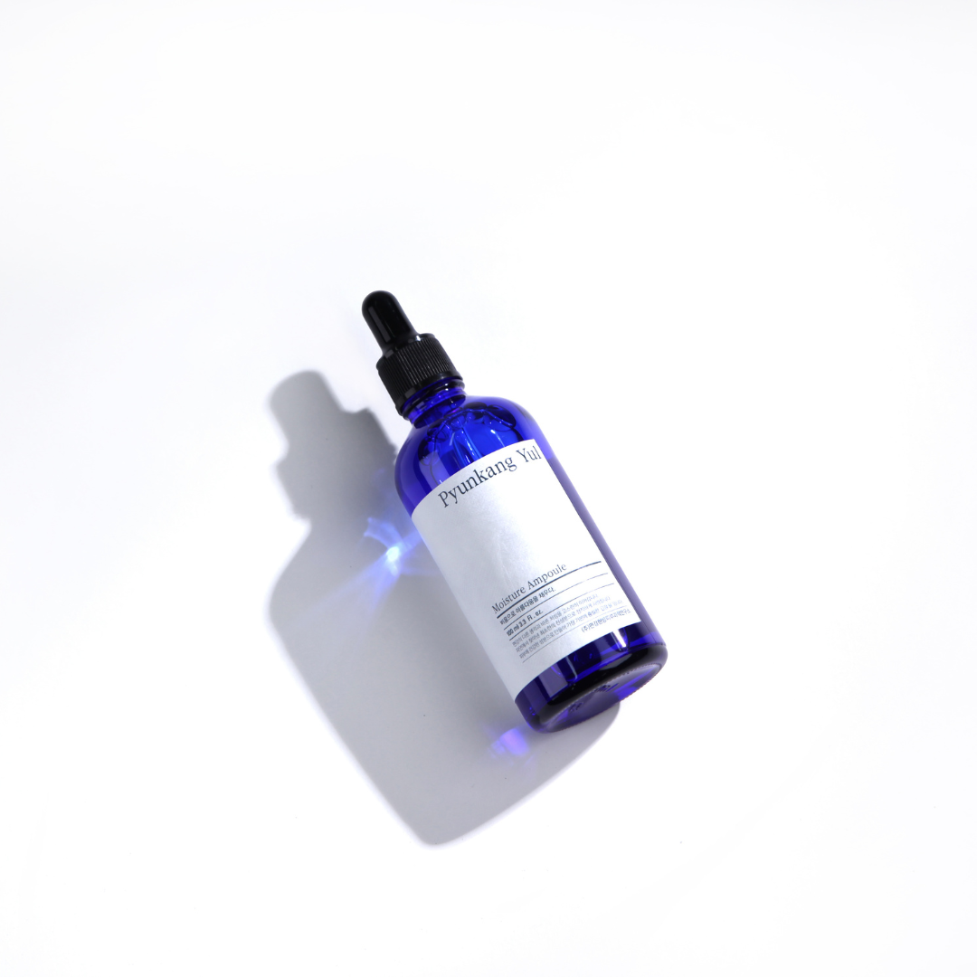 PyunKang Yul Moisture Ampoule 100ml in a clear glass bottle with a pump dispenser, designed for hydrating skincare.