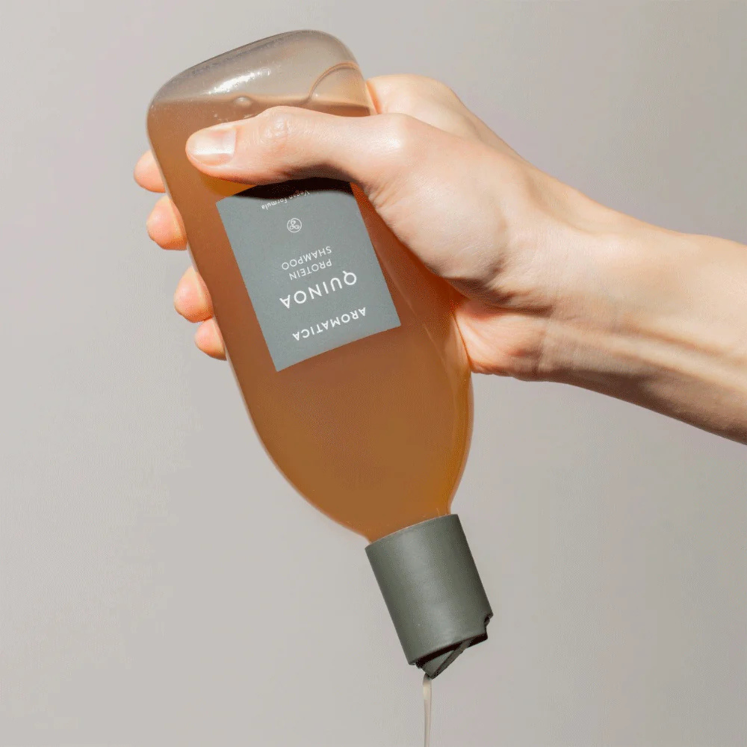 Aromatica Quinoa Protein Shampoo bottle in 400ml size, with the label visible, showcasing a natural hair care product.
