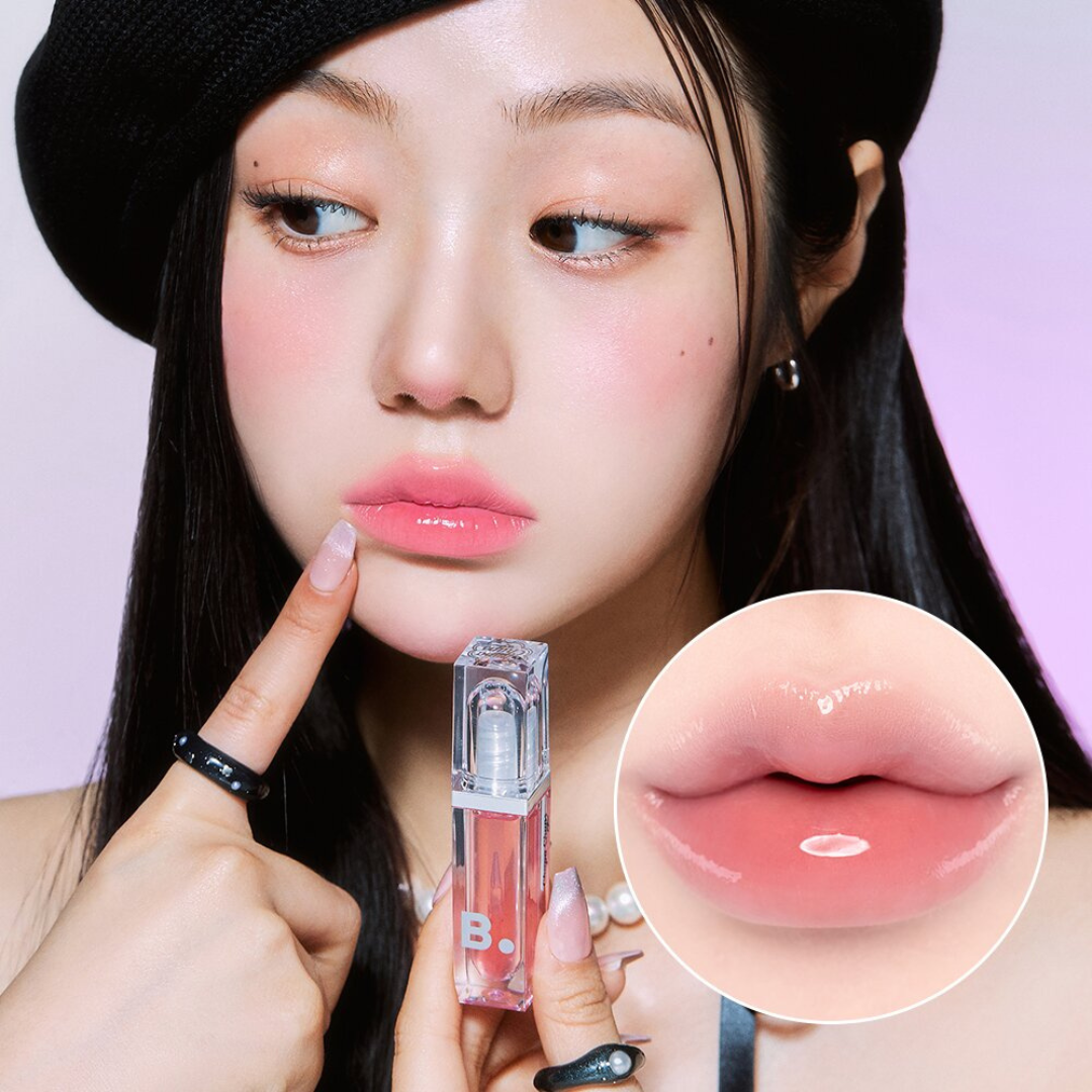 Banila Co Volume Lip Plumper showing a clear tube with pink-tinted lip plumping formula inside.