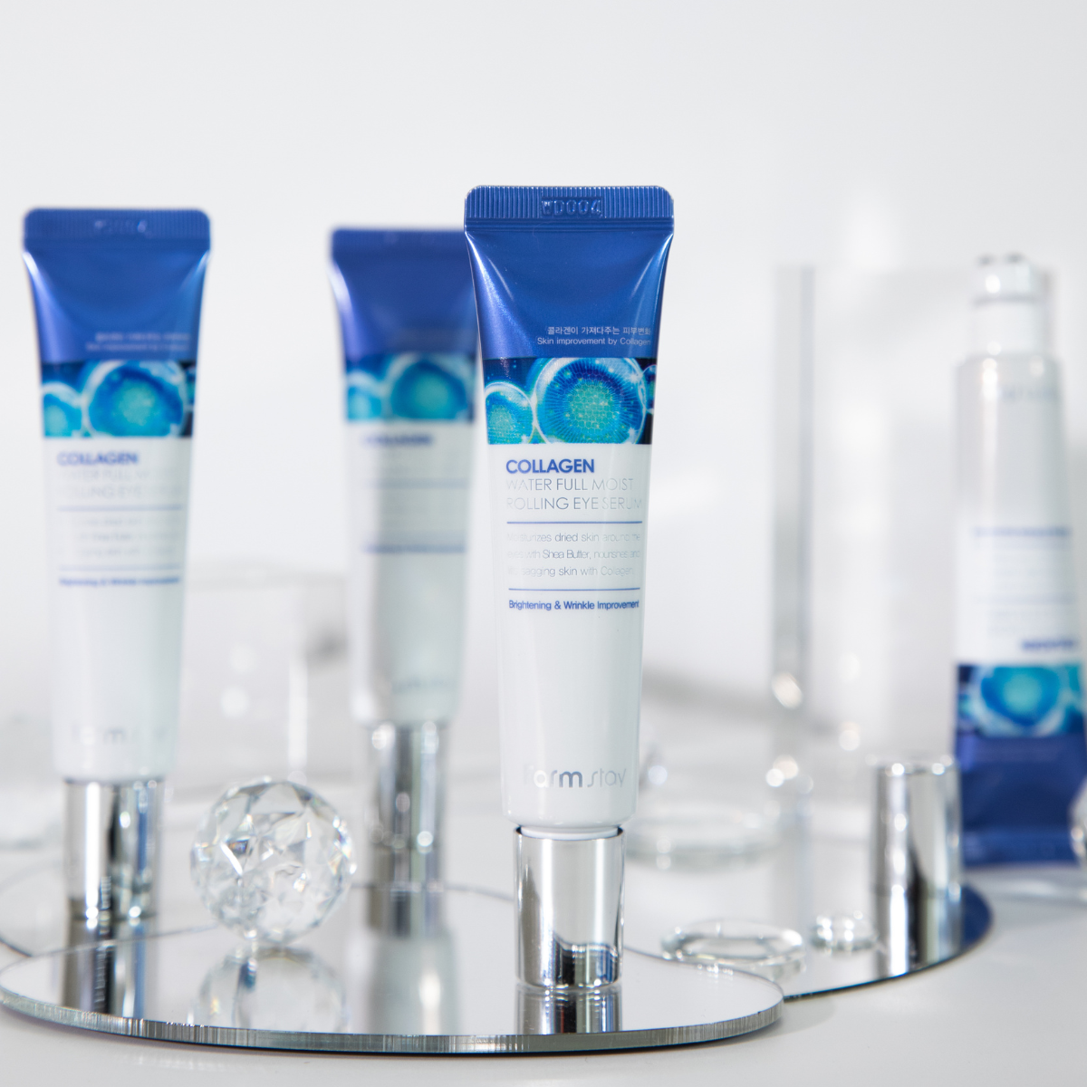 Farmstay Collagen Water Full Moist Rolling Eye Serum in 25ml bottle, showcasing the eye serum with a sleek design.
